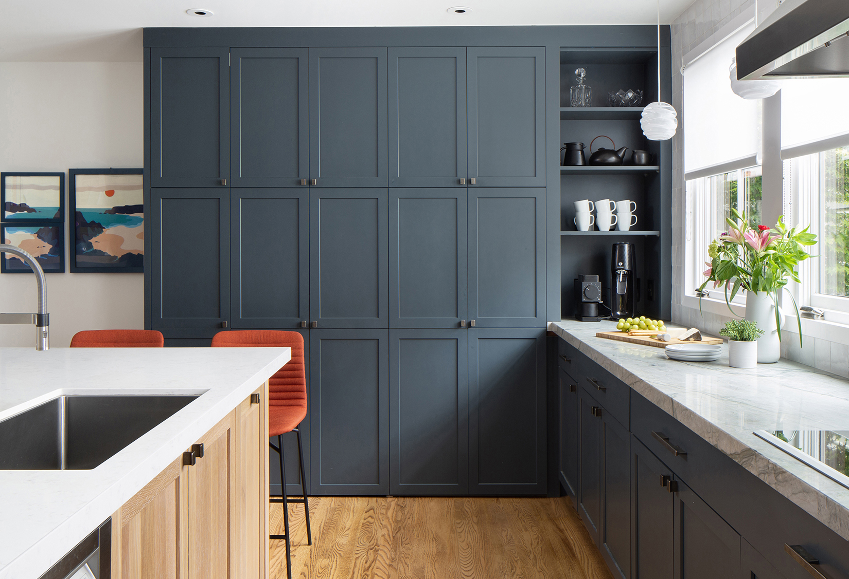 Chandler family kitchen blue pantry wall with open shelving and oak island sink
