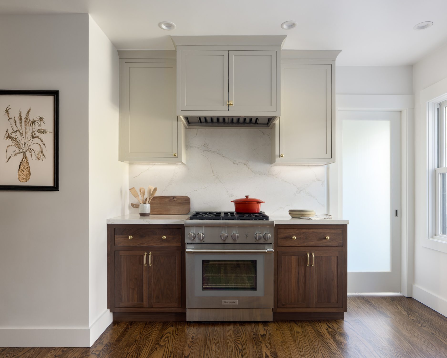 Paradise Valley range with walnut cabinets and a sage hood cabinet