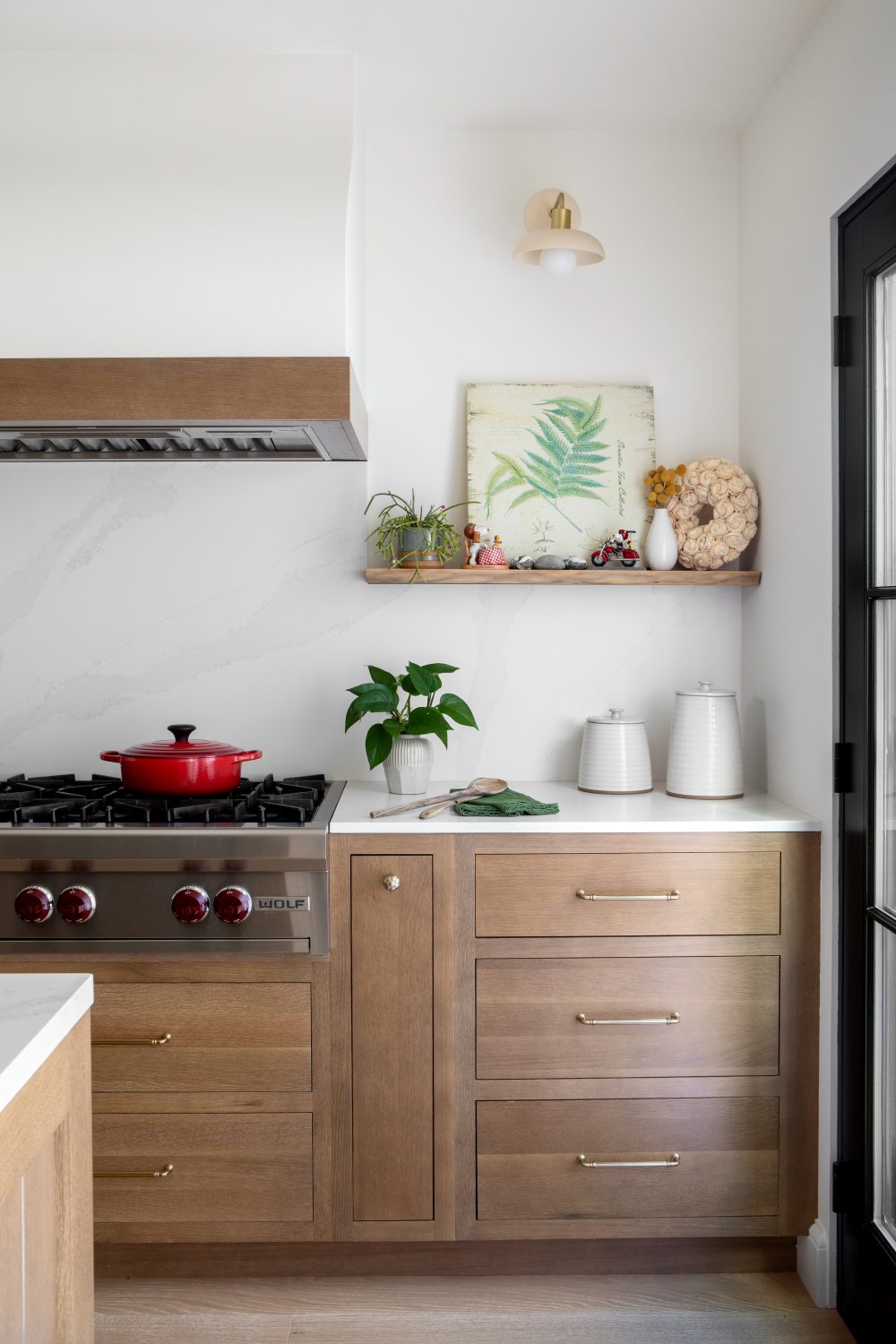 Tempe modern kitchen detail with a Wolf range and white oak cabinetry