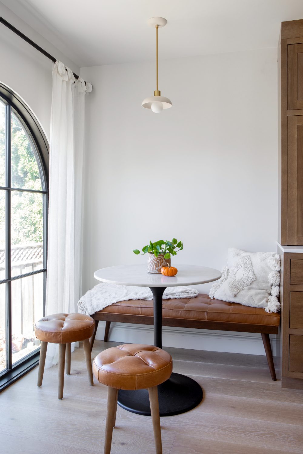 Tempe modern breakfast nook with marble table and leather bench