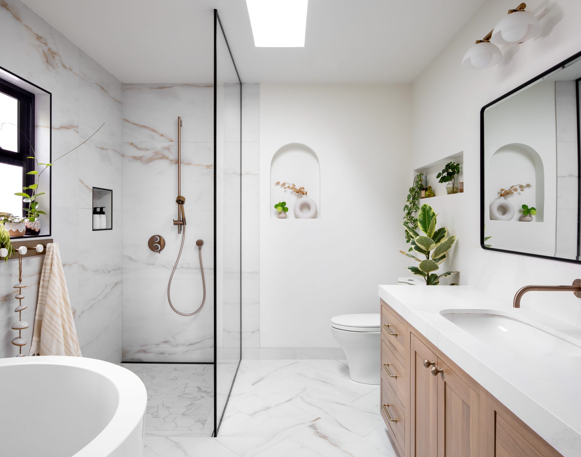 Tempe modern primary bath with marble walk-in shower and oak vanity